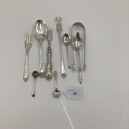 41 - A collection of sterling silver and white metal items to include sugar tongs, pickle fork etc, 170; ... 