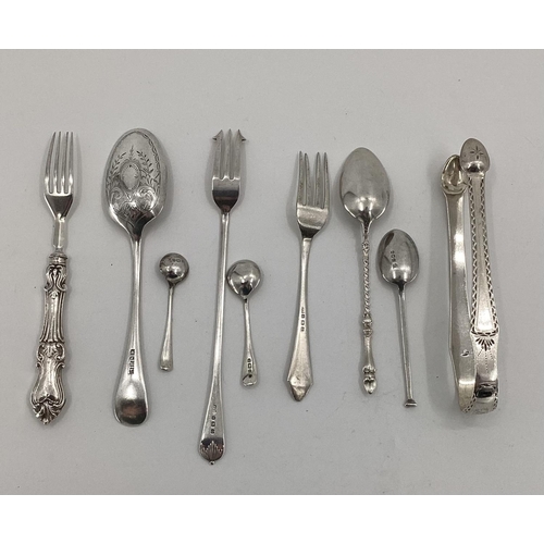 41 - A collection of sterling silver and white metal items to include sugar tongs, pickle fork etc, 170; ... 