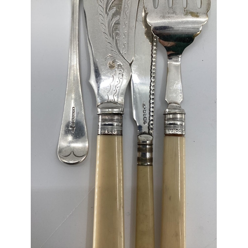 42 - A collection of unmarked white metal and silver plated items to include fish sauce pickle fork etc