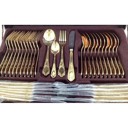 47 - A gilt metal cutlery service, 12 person, by Bestecke Solingen, in fitted leather briefcase  (unused)