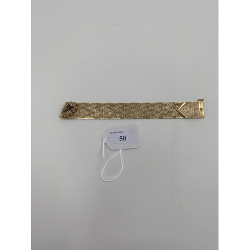 50 - A 9ct gold Tri coloured buckle bracelet, with cast leaf and sapphire clasp, 19cm, 80g