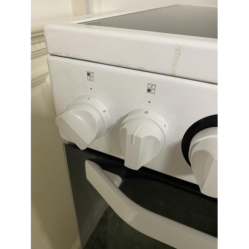 501 - Hotpoint cooker, with paperwork (auctioneer cannot guarantee working order of this lot, it is from a... 