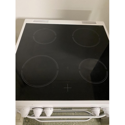 501 - Hotpoint cooker, with paperwork (auctioneer cannot guarantee working order of this lot, it is from a... 