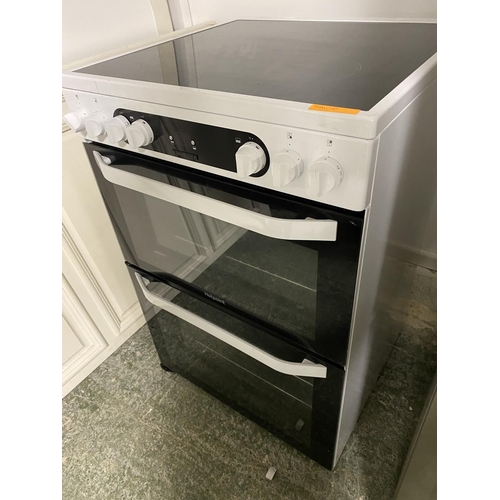 501 - Hotpoint cooker, with paperwork (auctioneer cannot guarantee working order of this lot, it is from a... 