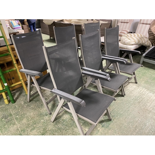 503 - GARDEN FURNITURE: a set of grey and black folding garden chairs