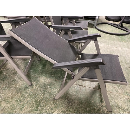 503 - GARDEN FURNITURE: a set of grey and black folding garden chairs