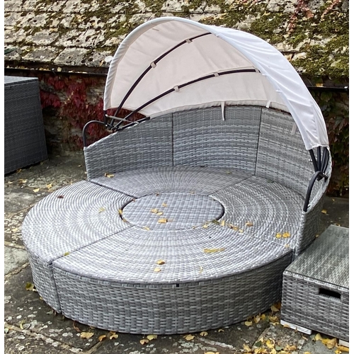 505 - GARDEN FURNITURE: Two similar grey faux rattan/all weather semi circular garden sun sofas and cream ... 