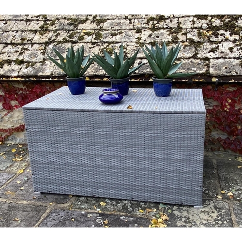 506 - GARDEN FURNITURE: a very large grey faux rattan/all weather garden storage chest, some minor wear, a... 