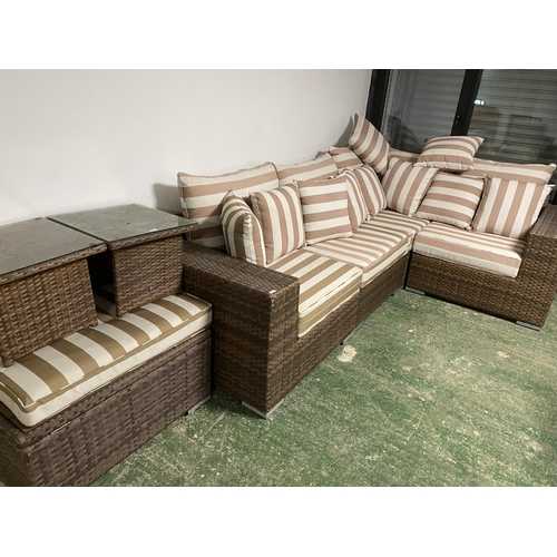 513 - GARDEN FURNITURE: A large garden L shaped sofa and brown striped cushion set, with small matching fr... 