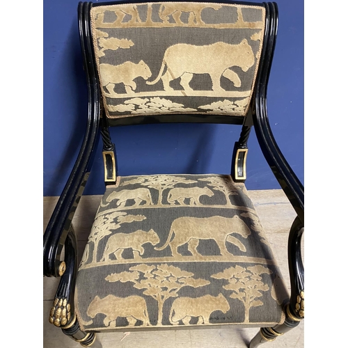 545 - Pair of contemporary black and gilt armchairs, upholstered in an African Safari upholstery, one arm ... 