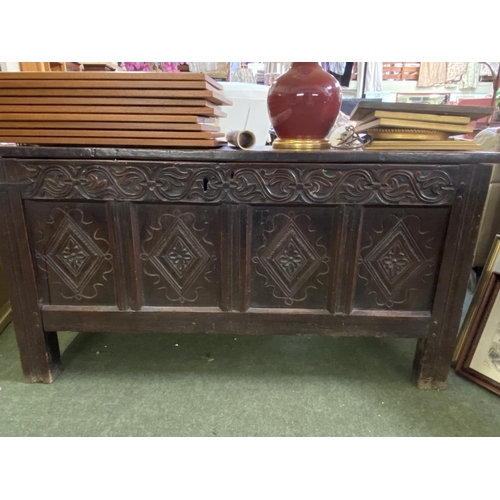 564 - An C18th and later heavy oak plank coffer, with carved front panels and frieze, 138cm Long, 71cmH, w... 