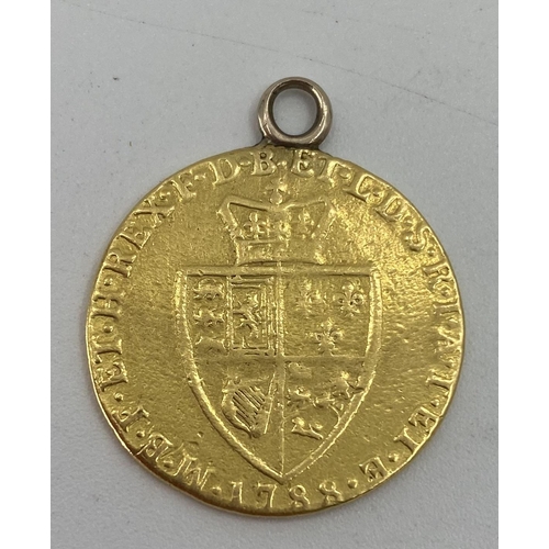 60 - A George III 1788 gold Guinea with soldered loop, 8.27g