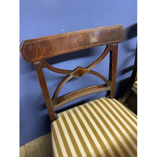 607 - Set of four Regency mahogany dining chairs (3 + carver), upholstered with overstuffed striped silk s... 