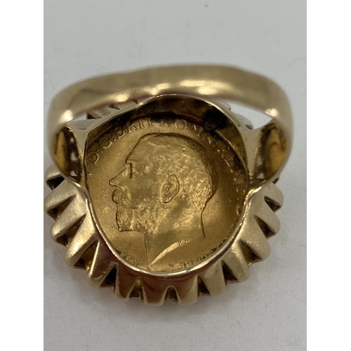 61 - George V gold sovereign ring in a 9ct gold mount 14.25g size V approx