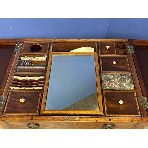 619 - A Regency inlaid and cross banded figured mahogany fold over washstand, with fitted interior, on tap... 