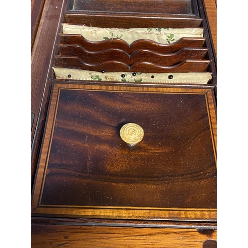 619 - A Regency inlaid and cross banded figured mahogany fold over washstand, with fitted interior, on tap... 