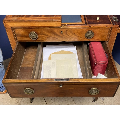 619 - A Regency inlaid and cross banded figured mahogany fold over washstand, with fitted interior, on tap... 