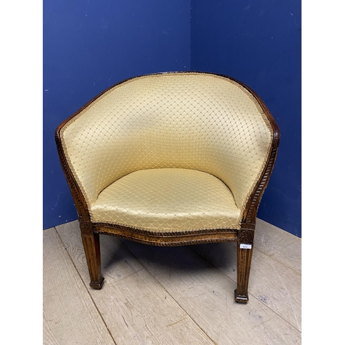 632 - A mahogany framed tub chair, upholstered in a worn yellow fabric, some repair needed