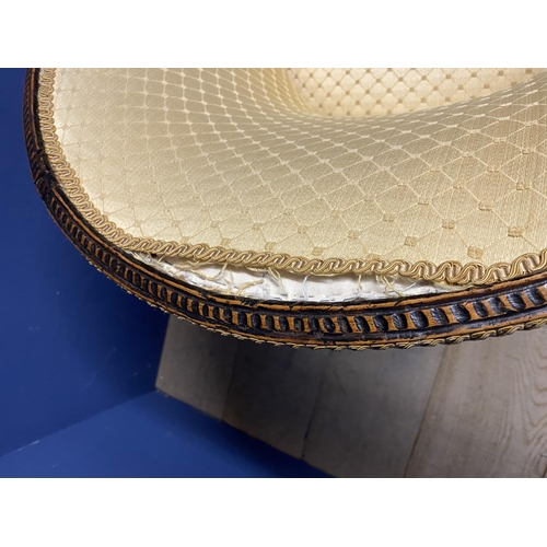 632 - A mahogany framed tub chair, upholstered in a worn yellow fabric, some repair needed