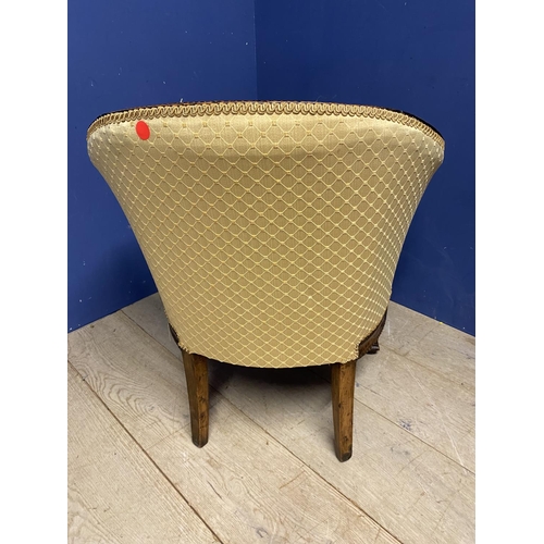 632 - A mahogany framed tub chair, upholstered in a worn yellow fabric, some repair needed