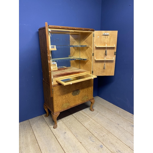 643 - .Art Deco style veneered drinks cabinet, with fitted mirrored interior,  some minor wear and losses