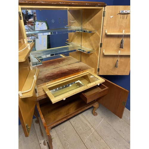 643 - .Art Deco style veneered drinks cabinet, with fitted mirrored interior,  some minor wear and losses