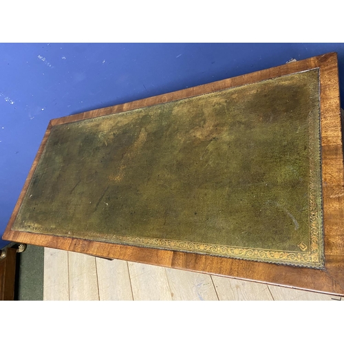 660 - A good mahogany writing table, with 3 drawers, below a tooled green leather skiver, on brass castors... 