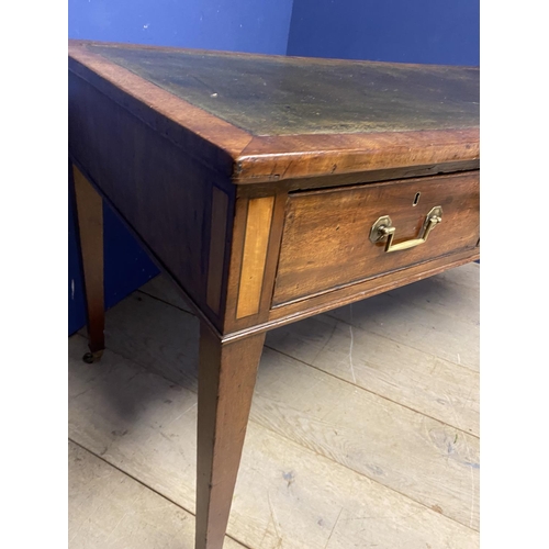 660 - A good mahogany writing table, with 3 drawers, below a tooled green leather skiver, on brass castors... 