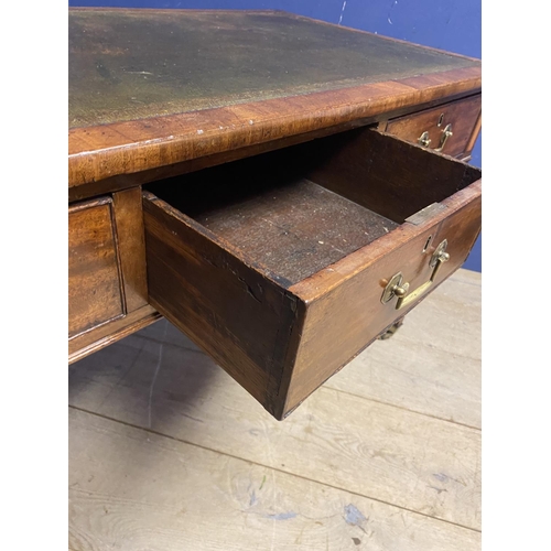 660 - A good mahogany writing table, with 3 drawers, below a tooled green leather skiver, on brass castors... 