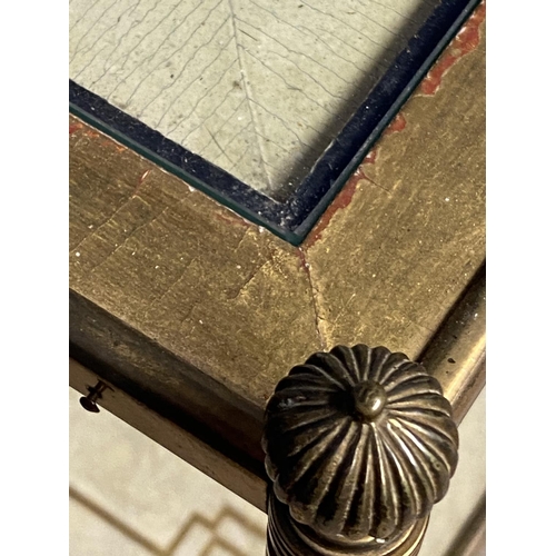 668 - Two tier brass and gilt side table, inset with dominos style patterned counters. Dimension: 44 cm x ... 