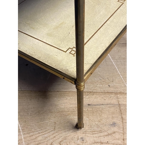 668 - Two tier brass and gilt side table, inset with dominos style patterned counters. Dimension: 44 cm x ... 