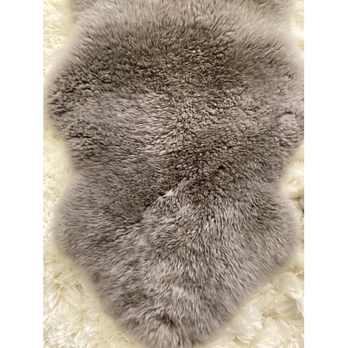 694 - Two 100% sheepskin silver grey rugs, 160 x 60cm