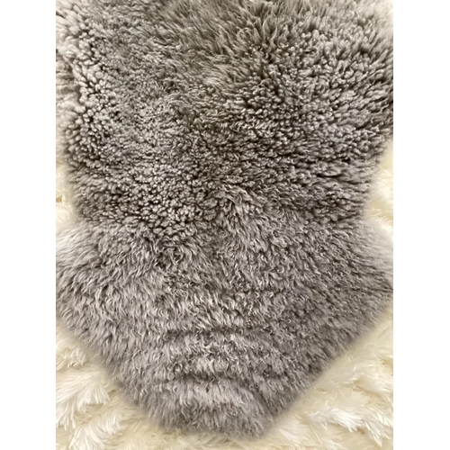 694 - Two 100% sheepskin silver grey rugs, 160 x 60cm