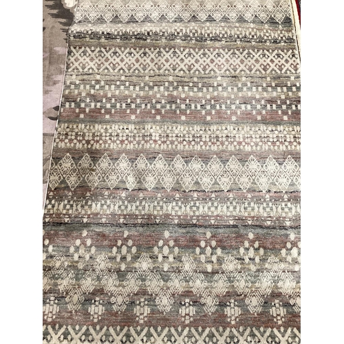 696 - FIVE rugs: Blue/cream 100% wool Indian pattern rug, 123 x 183; Tapestry style brown/red tones rug, l... 