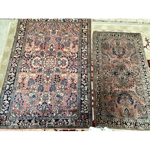 698 - Two small antique rugs pattern blues/reds, 100 x 147 and 67 x 122, slight fray at ends