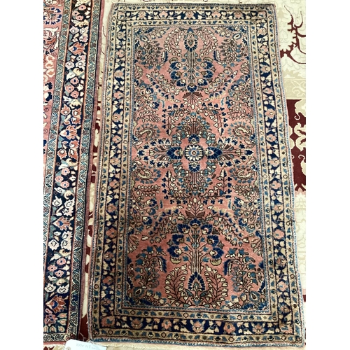 698 - Two small antique rugs pattern blues/reds, 100 x 147 and 67 x 122, slight fray at ends