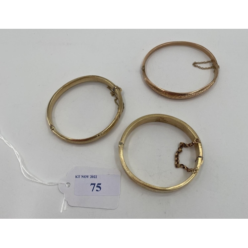 75 - Three 9ct gold bangle bracelets 34.8g