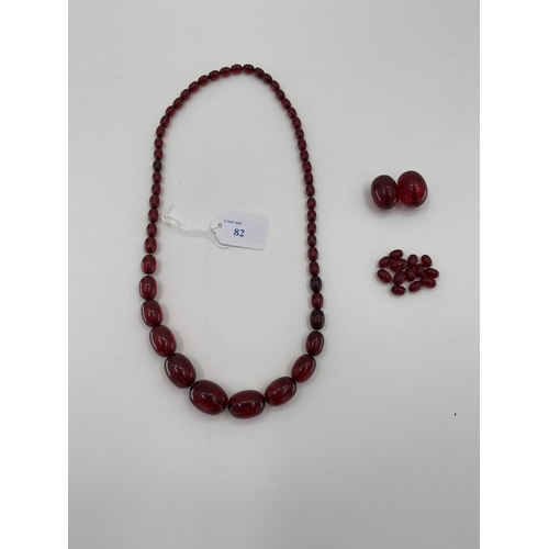 82 - A string of cherry amber graduated beads with additional beads, 106g, 70cm