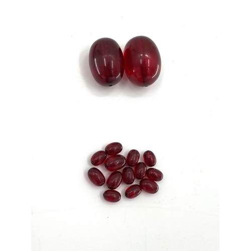 82 - A string of cherry amber graduated beads with additional beads, 106g, 70cm