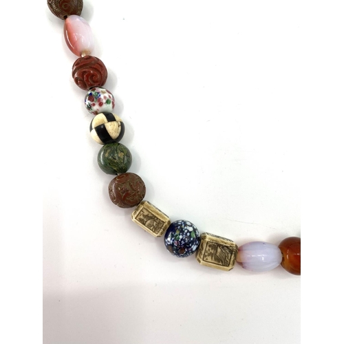 84 - A strand of antique Chinese glass court beads with a bone and coral examples