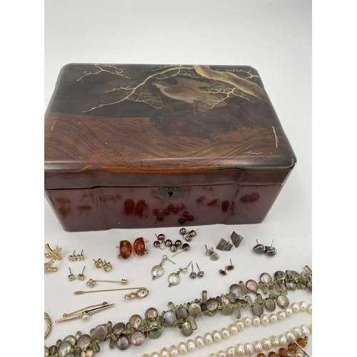 86 - A collection of costume jewellery in a Japanese inlaid lacquered box, with a dome topped jewellery c... 