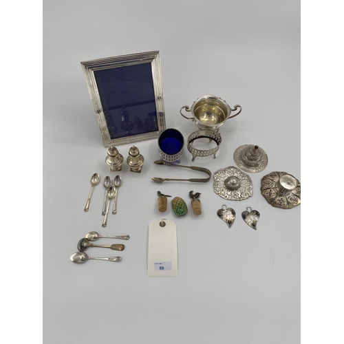 88 - A collection of sterling silver white metal items to include tea strainer, picture frame, ETC