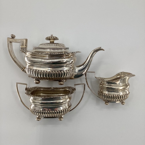 9 - A sterling silver 3 piece tea set of half reeded design by JW Story and W Elliot, London 1812, 1300g... 