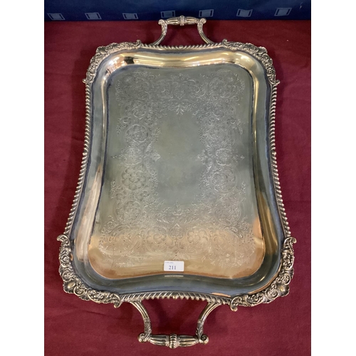 92 - A large oblong silver plated tray, cast border, chased decoration with loop handles 69 cm x  41 cm, ... 