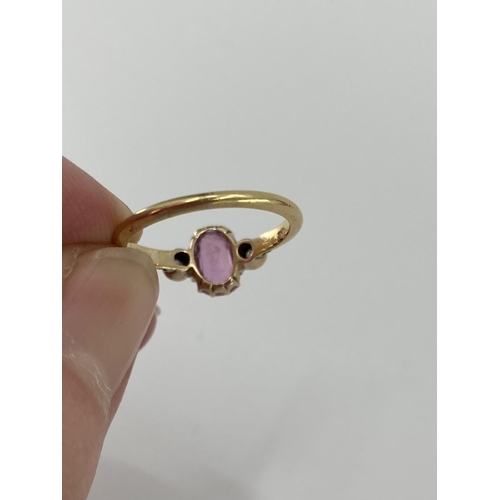 95 - An 18ct gold fancy pink sapphire and diamond ring, central oval free cut sapphire with old brilliant... 