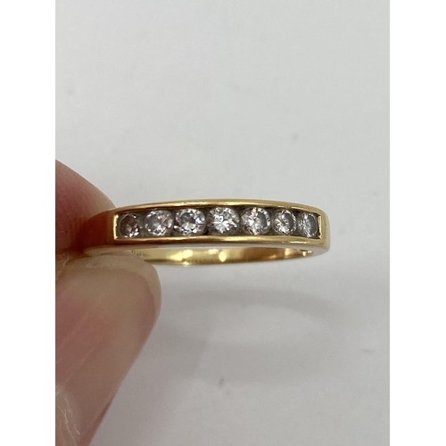 97 - Two 18ct gold and diamond rings, each channel set with a line of single cut diamonds, 5.31g K/M size... 