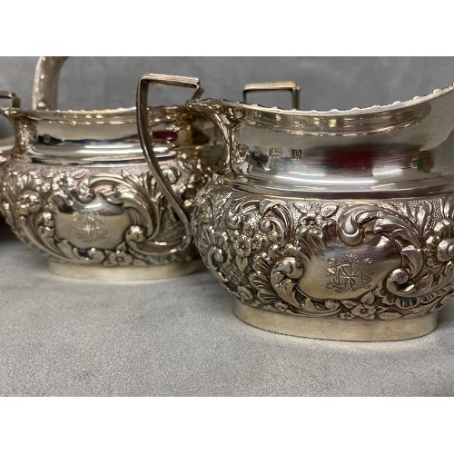 51 - A sterling silver three piece tea set with Acanthus leaf decoration by Williams Ltd Birmingham 1901 ... 