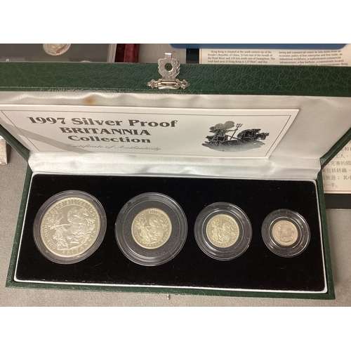 200 - A collection of silver and white metal commemorative  coins to include silver proof examples.