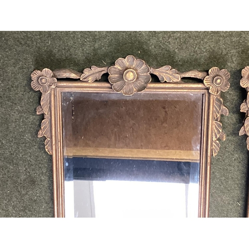 243 - Pair of rectangular gilt gesso wall mirrors with cup and swag decoration.  79 cm H x 35 cm W