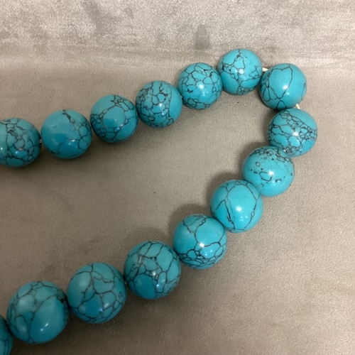 269 - A large faux turquoise bead necklace